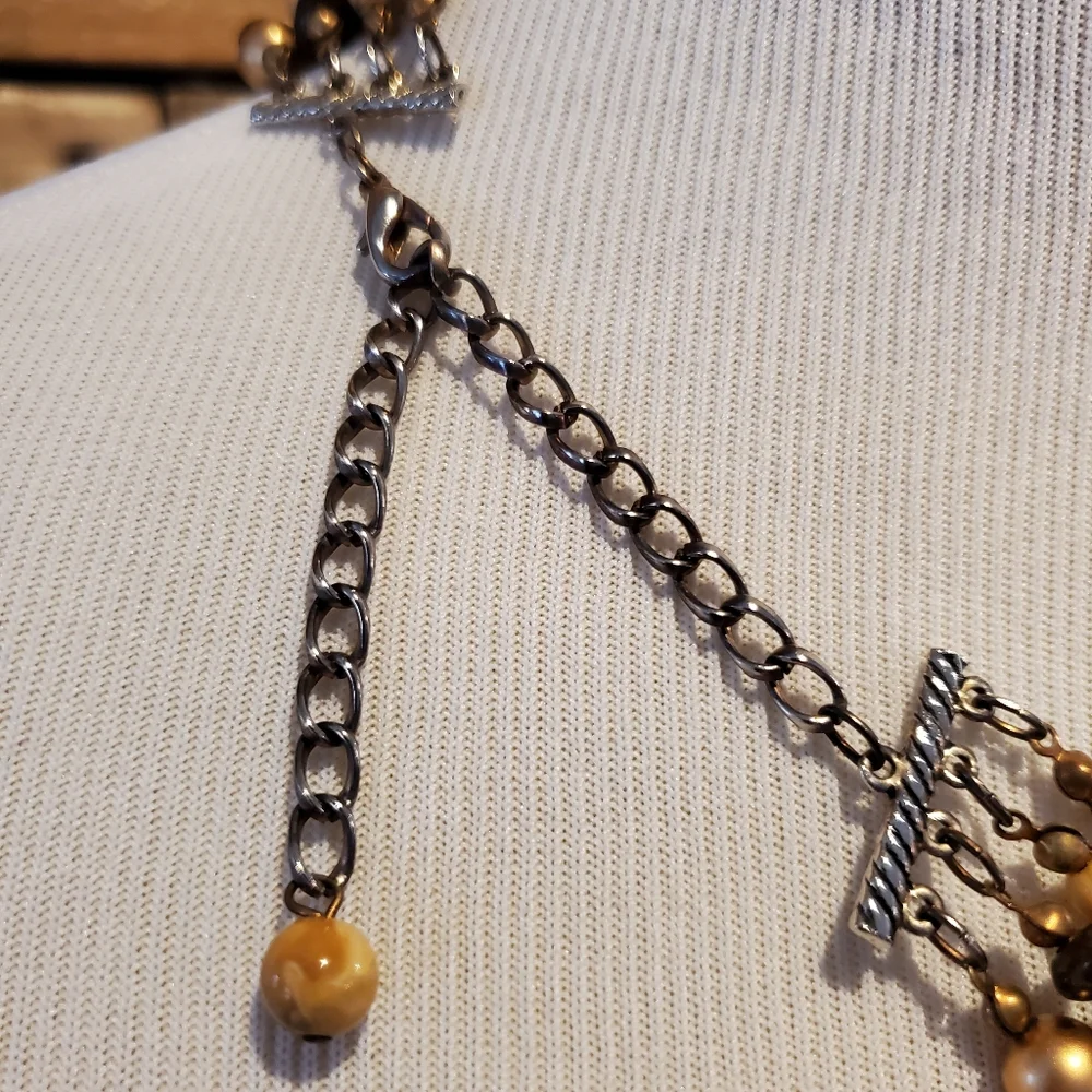 Multi-strand necklace in gold, brown, cream and faux tiger eye beads